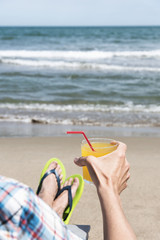 Wall Mural - young man relaxing on the beach