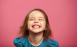 © Ilshat - Joyful little girl sincere laughing at pink isolated background.