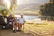 © Monkey Business - Senior Couple Enjoying Camping Vacation By Lake Making A Toast