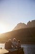 © Monkey Business - Grandchildren With Grandparents Sitting On Wooden Jetty By Lake
