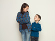 © Prostock-studio - Happy brother and sister, studio background