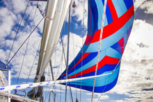Flying A Colorful Spinnaker On A Seaworthy Sailing Yacht