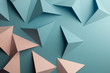 Close-up of pink and blue triangular shapes of paper, abstract background