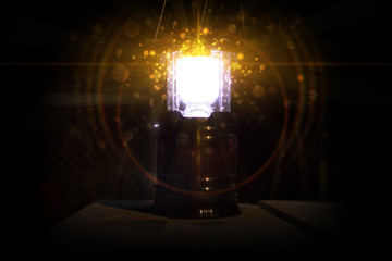Wall Mural - magic glow of the lantern, magic on a dark background