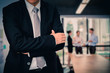 © S photographer - Male model in a suit posing on office background