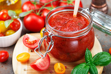 Tomato Sauce In A Glass Jar And Ingredients.
