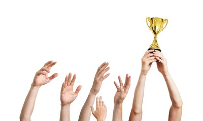 Wall Mural - Many hands raised up. Winner is holding trophy in hands. Isolated on white background.