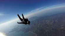 Skydiver Jump Over The Sea And Mountains
