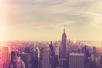 Wall Mural - Vintage style image of buildings across New York City at sunset with retro filter 