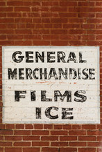 General Merchandise Sign On Side Of An Old Brick Building