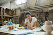 © Jelena Jojic Tomic/Stocksy - Furniture designer at her workshop
