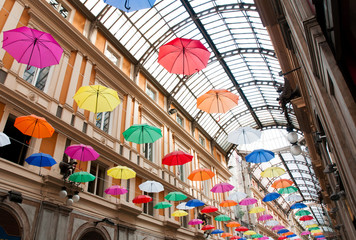 Wall Mural - Genoa, Galleria Mazzini decorated with colored umbrellas hanging from its ceiling (event: Euroflora 2018)