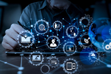 Poster - businessman hand working with modern technology digital tablet computer and digital layer effect