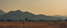 Farmland ,wastelands With Mountains In Background During Sunset On Central Montenegro