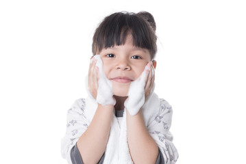 child happy cleanses the skin on a white background isolated