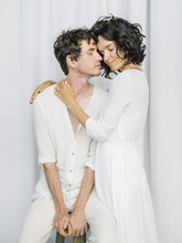 Charming Couple In White Posing Together