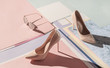 © Audrey Shtecinjo/Stocksy - Composition of stylish high heel shoes with feminine accessories .
