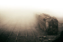 Abandoned Rusting Train And Empty Train Tracks Photographed In Misty Foggy Day In The Village Paranapiacaba, Sao Paulo, Brazil. Photo Color Toned With Sepia For Surreal And Vintage Nostalgic Look.