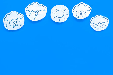 Wall Mural - modern weather icons set on blue background top view copy space