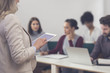 © LStockStudio - Businesswoman Presenting in Front of Audience
