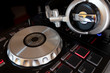 © kasipat - DJ to mix & play music on Turntable vinyl record player