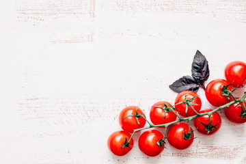 Vintage white board to write the menu and cherry tomatoes. Flat lay, top view, copy space 