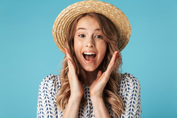 Poster - Surprised happy woman in dress and hat looking at camera