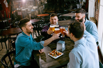 Wall Mural - Men Drinking Beer In Pub