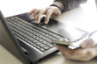© studio2013 - Hands using laptop and smartphone for online shopping with daytime soft light shining high contrast