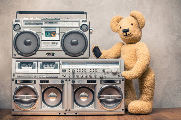 Wall Mural - retro teddy bear toy standing near boombox cassette ghetto blasters radio recorders from 80s front c