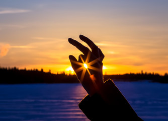 Winter sun in hand. Photo from Kuhmo, Finland.