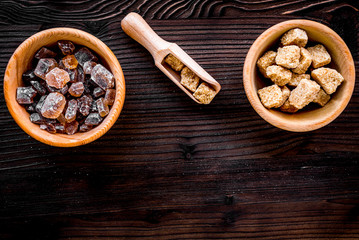 cooking sweets set with sugar in bowls on kitchen table backgrou