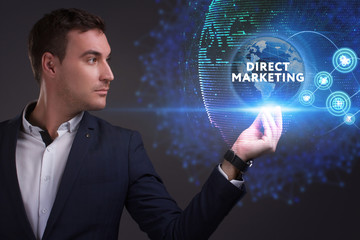 Business, Technology, Internet and network concept. Young businessman working on a virtual screen of the future and sees the inscription: Direct marketing