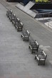 a beautiful photo of wooden benches in a row, London, England