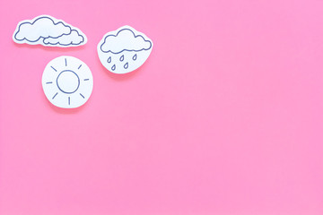 Wall Mural - rainfall forecast concept. weather icons. rainy cloud, lightening on pink background top view copy s