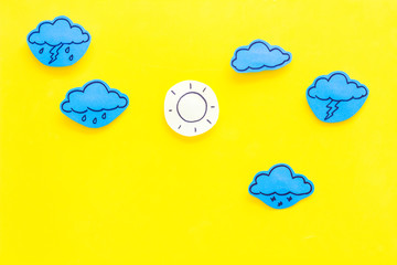 Wall Mural - modern weather icons set on yellow background top view copy space