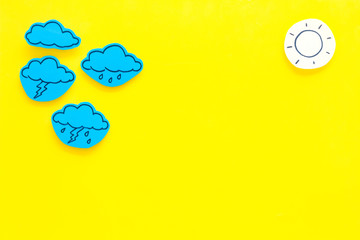 Wall Mural - modern weather icons set on yellow background top view copy space