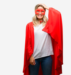 Canvas Print - Young super hero woman wearing cape terrified and nervous expressing anxiety and panic gesture, overwhelmed