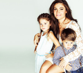 young mother with two children on white background, happy smilin