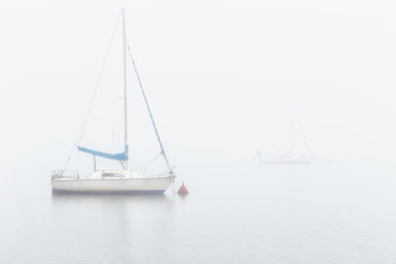 Sail boats in a foggy morning in Alava