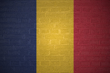 Flag of Chad on brick wall background, 3d illustration