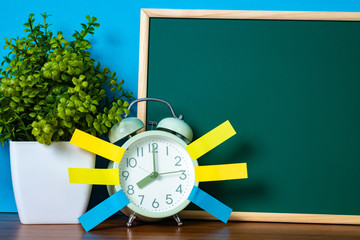 Wall Mural - Note paper sticky and vintage alarm clock and blank green chalkboard on table with copy space for add text notice something, list memo and schedule concept.