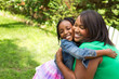 © digitalskillet1 - Happy African American mother and daughter.