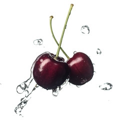 Wall Mural - Fresh and juicy cherry fruit served in a splash of water