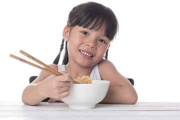 Cute asian girl eating noodle on white background isolated