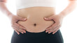 © thaiview - Belly fat in women and fat woman touching her stomach