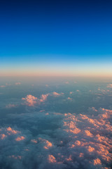 Wall Mural - Flying above the clouds. Aerial view from the airplane