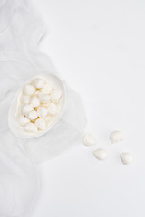 Wall Mural - top view of mozzarella cheese curds on white surface