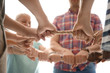 © New Africa - People holding rope together on light background, closeup of hands. Unity concept