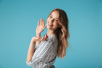 Poster - Side view of Happy blonde woman in dress clapping